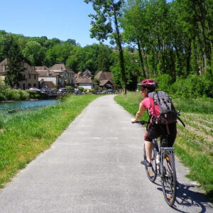 Riding a hybrid bike near Chanaz following the Via Rhona